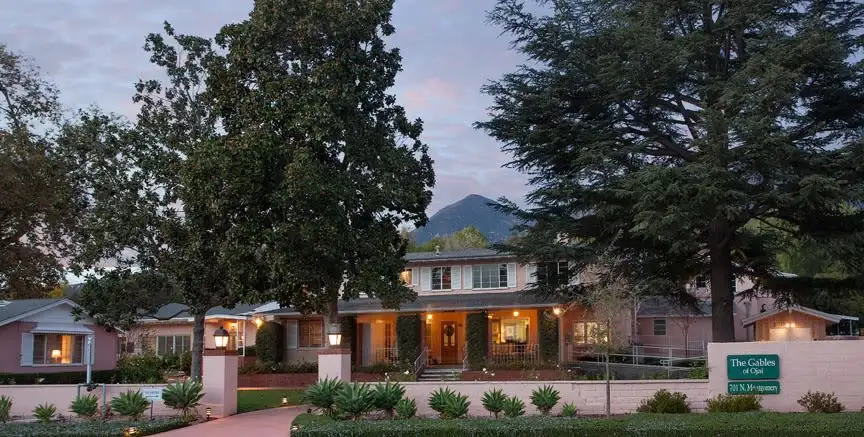 Gables of Ojai illuminated at dusk with mountain backdrop
