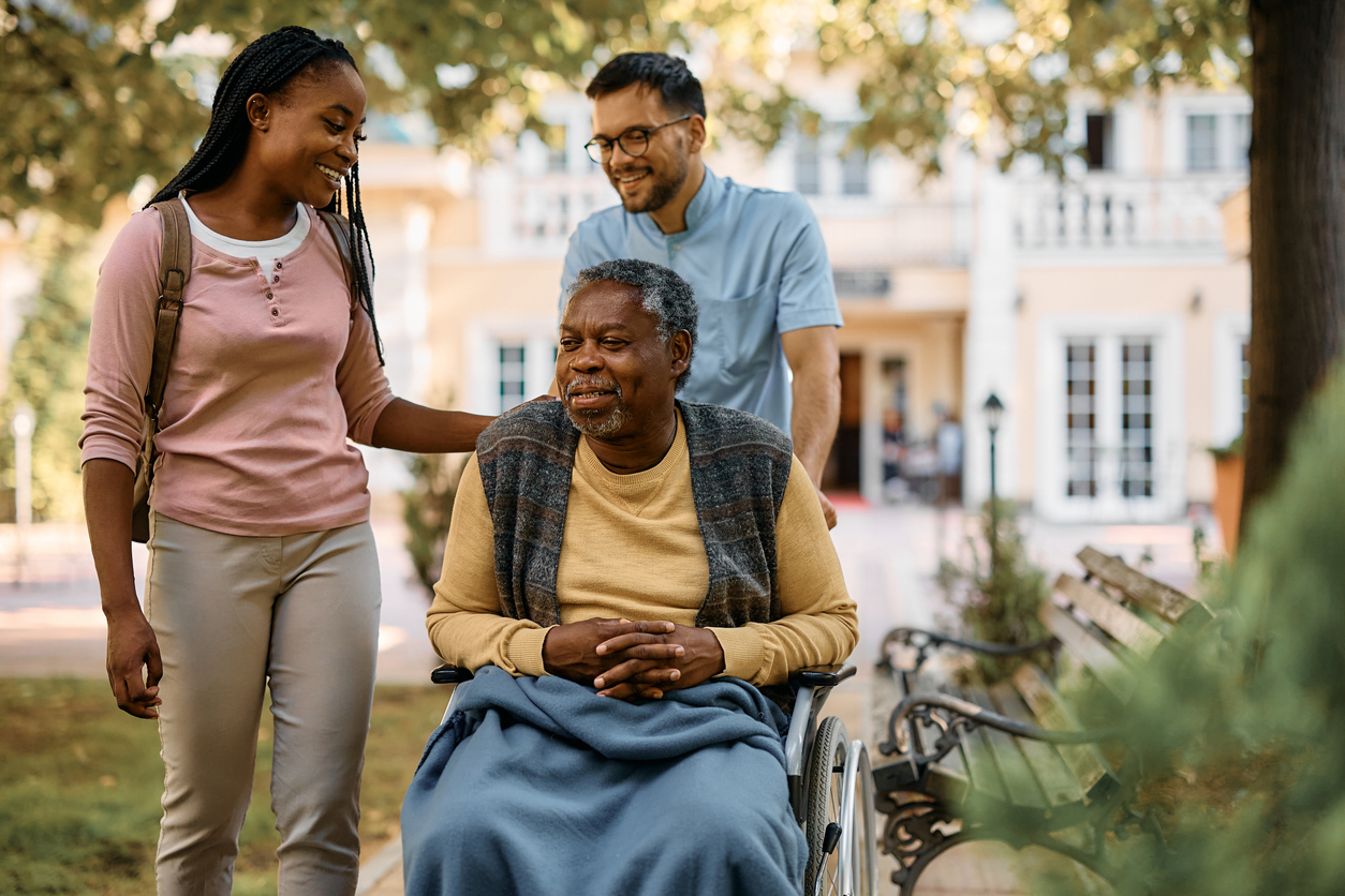 Multigenerational family supporting elderly loved one at Gables of Ojai
