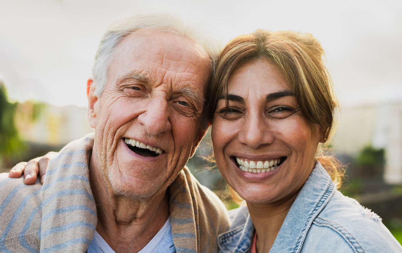 Smiling senior and caregiver enjoying activities at Gables of Ojai